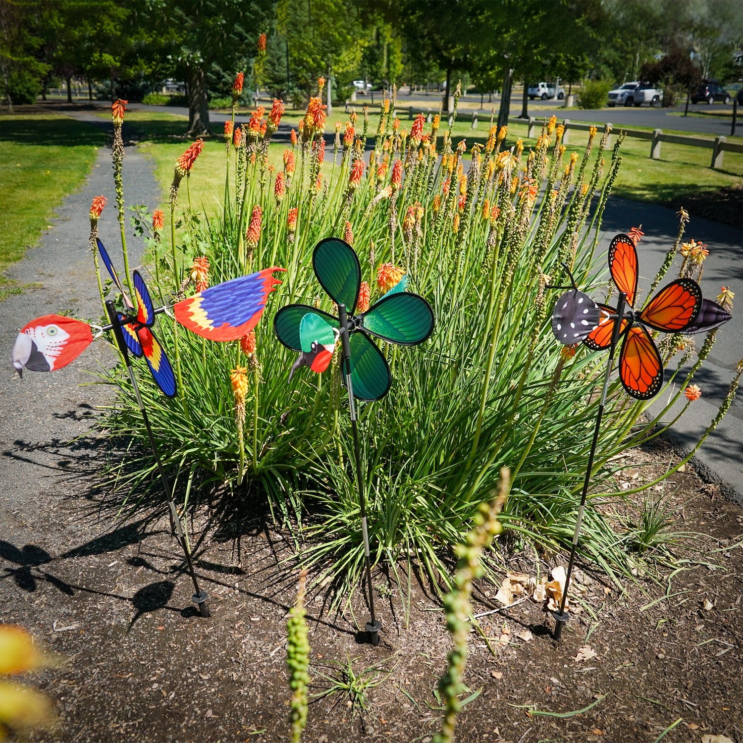 Pivoting Hummingbird Spinner featuring a colorful 15-inch petal wheel, showcasing hummingbirds, spins and pivots in the garden.