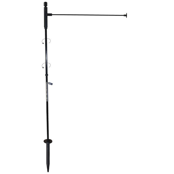 Pivoting Low-Profile Garden Flag Pole displayed in a garden with a vibrant 12x18-inch garden flag attached, showcasing its flexible design.