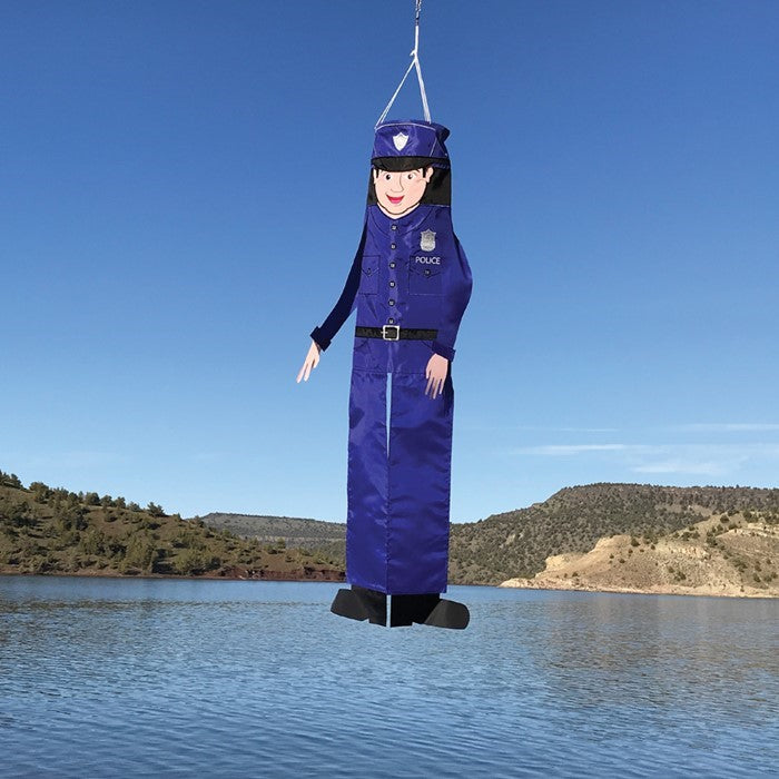 Police Officer 40-Inch Breeze Buddy windsock with detailed applique design and free-flowing limbs, hanging outdoors in a garden setting.