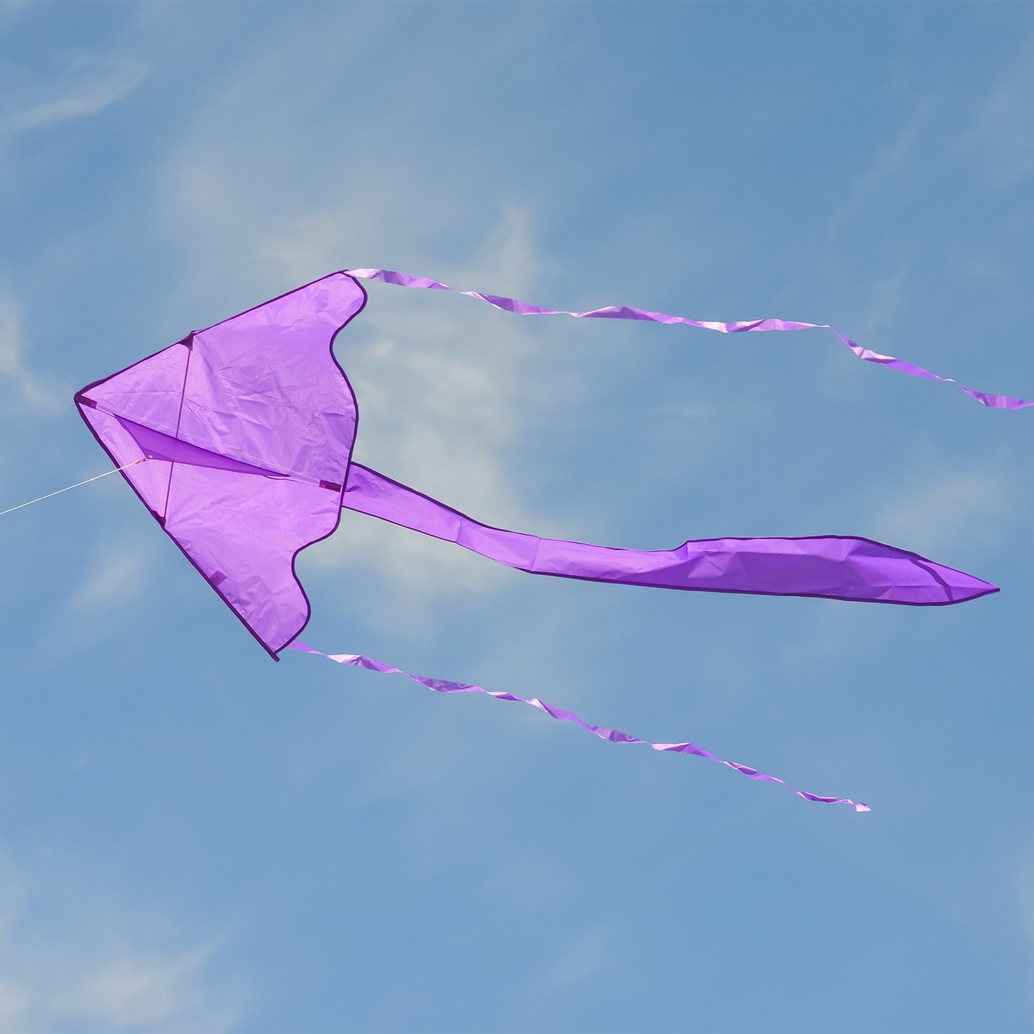 Purple Colorfly 43\" Fly-Hi Kite soaring in the sky, showcasing its solid color design and delta shape, ideal for beginner kite flyers.