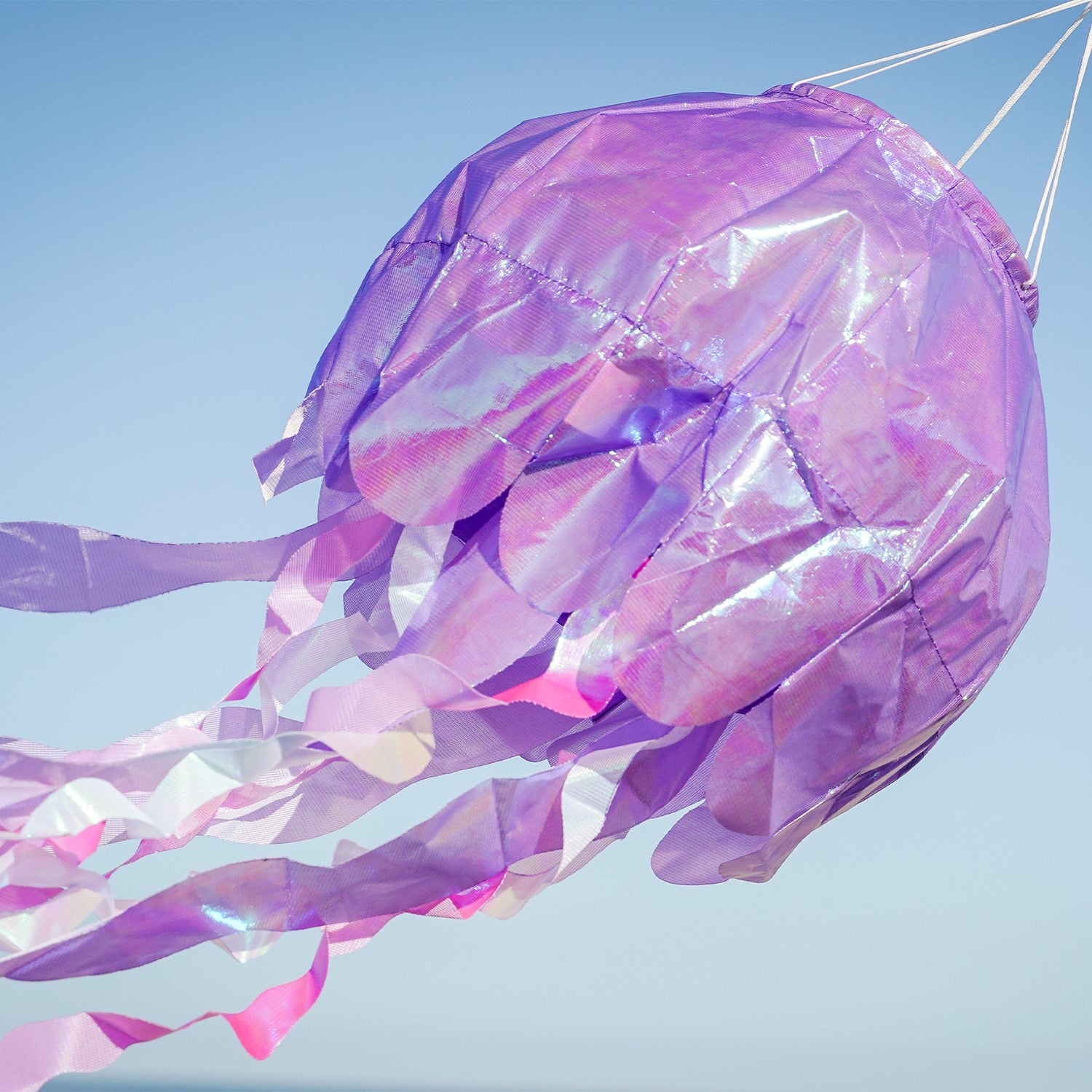 40-inch Purple Iridescent Jellyfish 3D Windsock with colorful tentacles fluttering in the wind, showcasing its lifelike design.