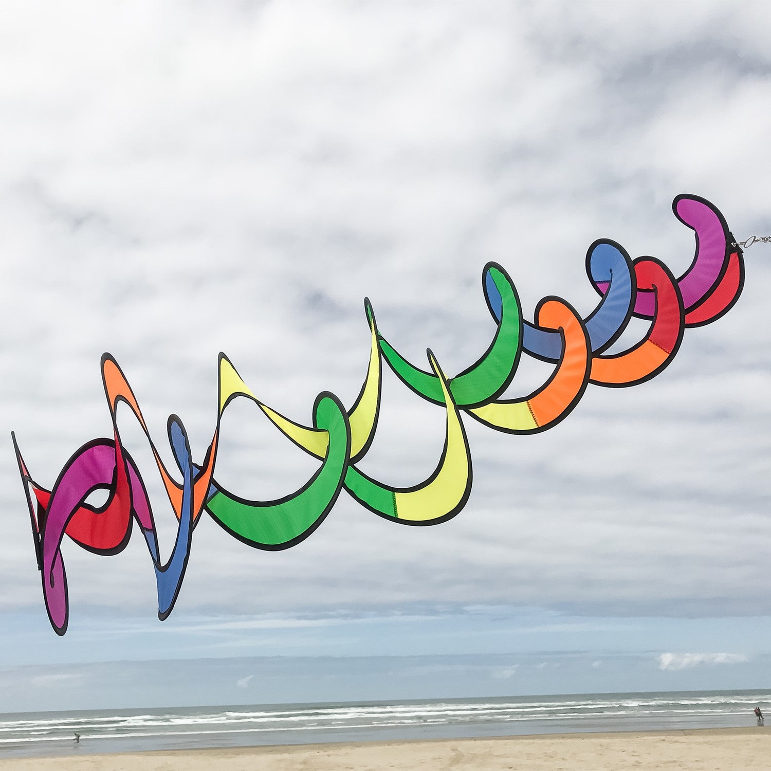 Vibrant Rainbow Curlie Duet hanging twister made from weather-resistant fabric, featuring a double helix design that spins gracefully with the wind.