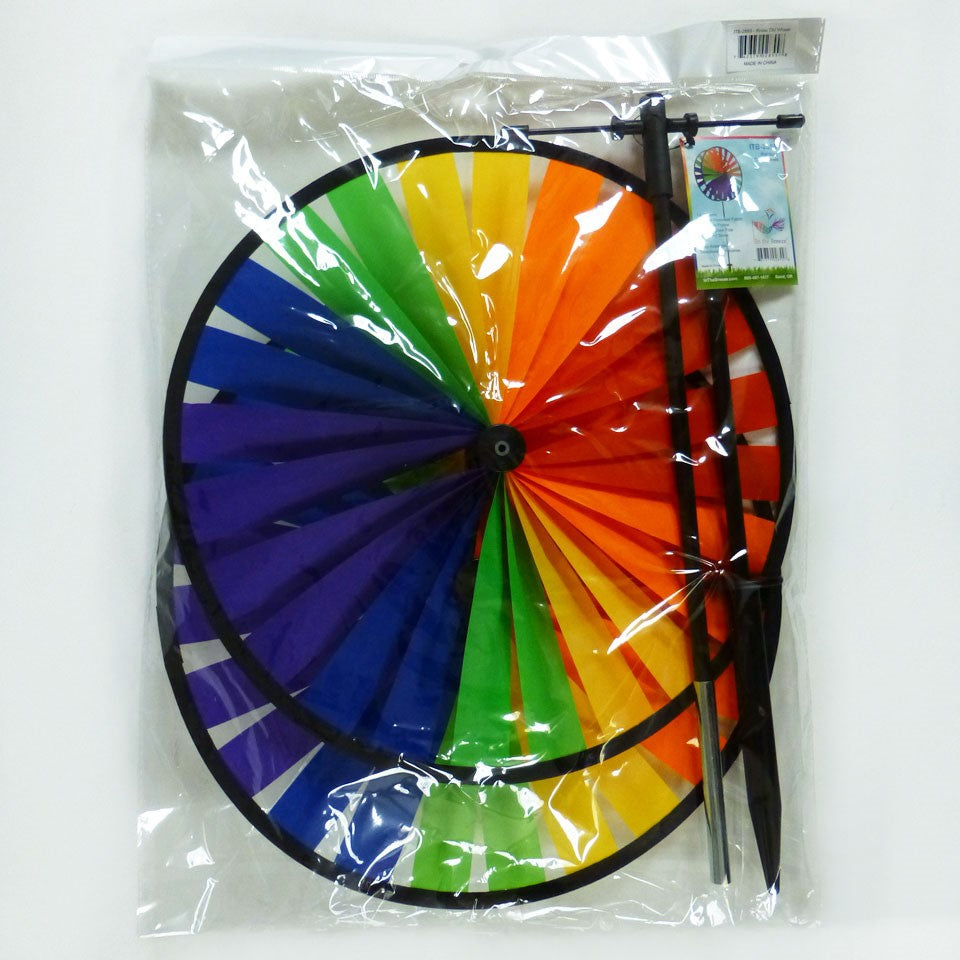 Rainbow Duo Wheel Spinner featuring two colorful spinning wheels on a fiberglass pole, creating a vibrant outdoor decoration.