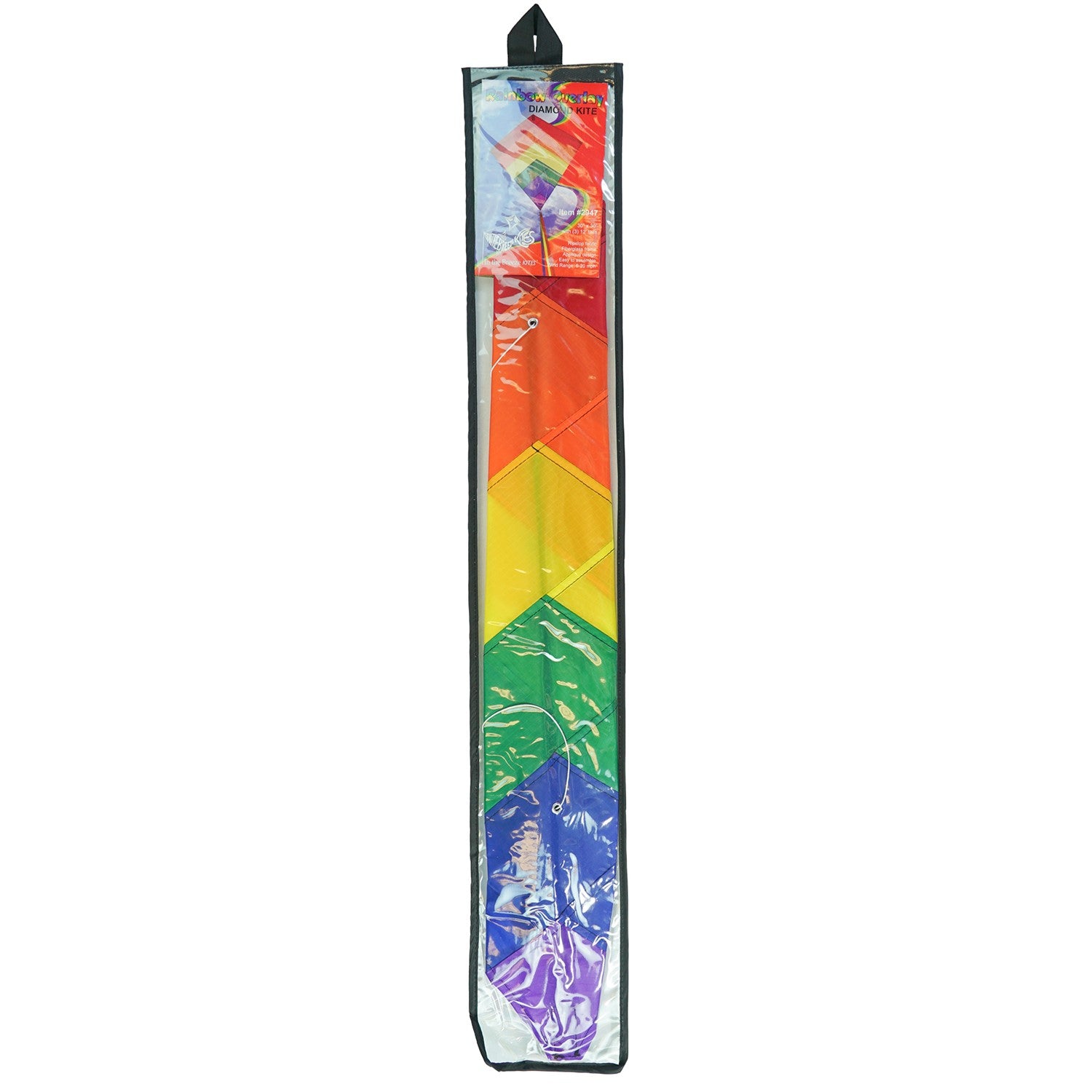 Rainbow Overlay 30-inch Diamond Kite flying in the blue sky with colorful streamer tails trailing below, showcasing its vibrant design.
