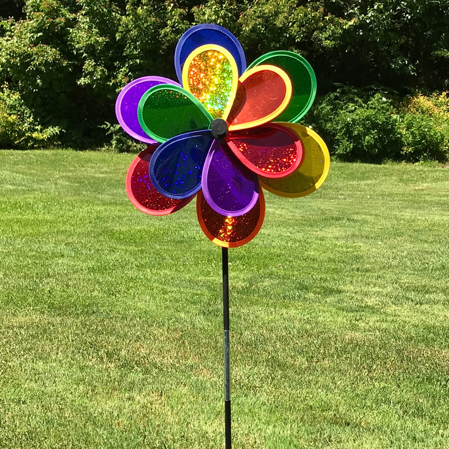Rainbow Sparkle Double Flower garden spinner featuring double Mylar petals in a brilliant rainbow spectrum, easily rotates in the breeze to brighten gardens.