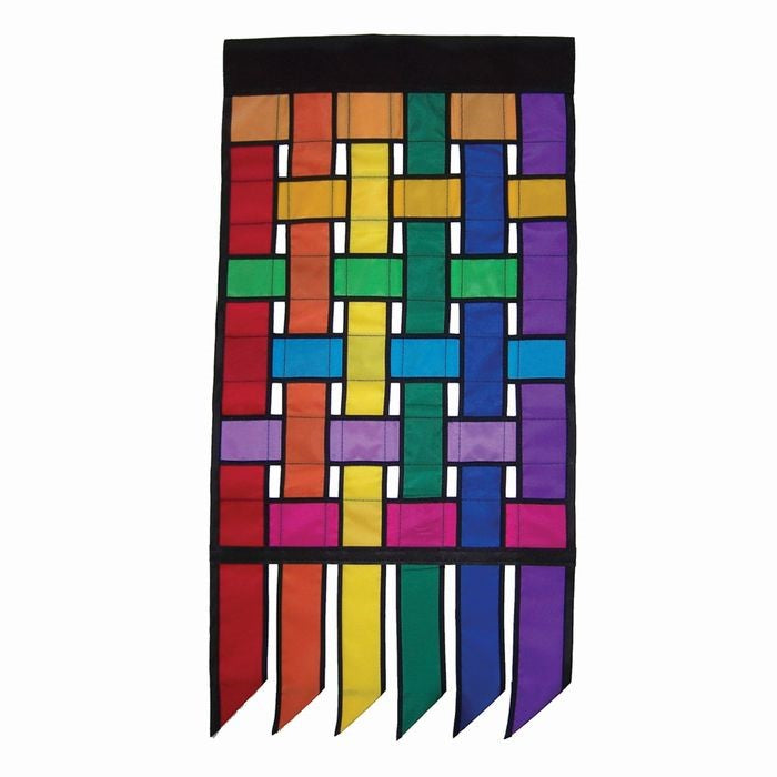 Rainbow Weave Garden Flag Tails featuring interwoven vibrant colors fluttering in the wind, enhancing the outdoor garden decor.