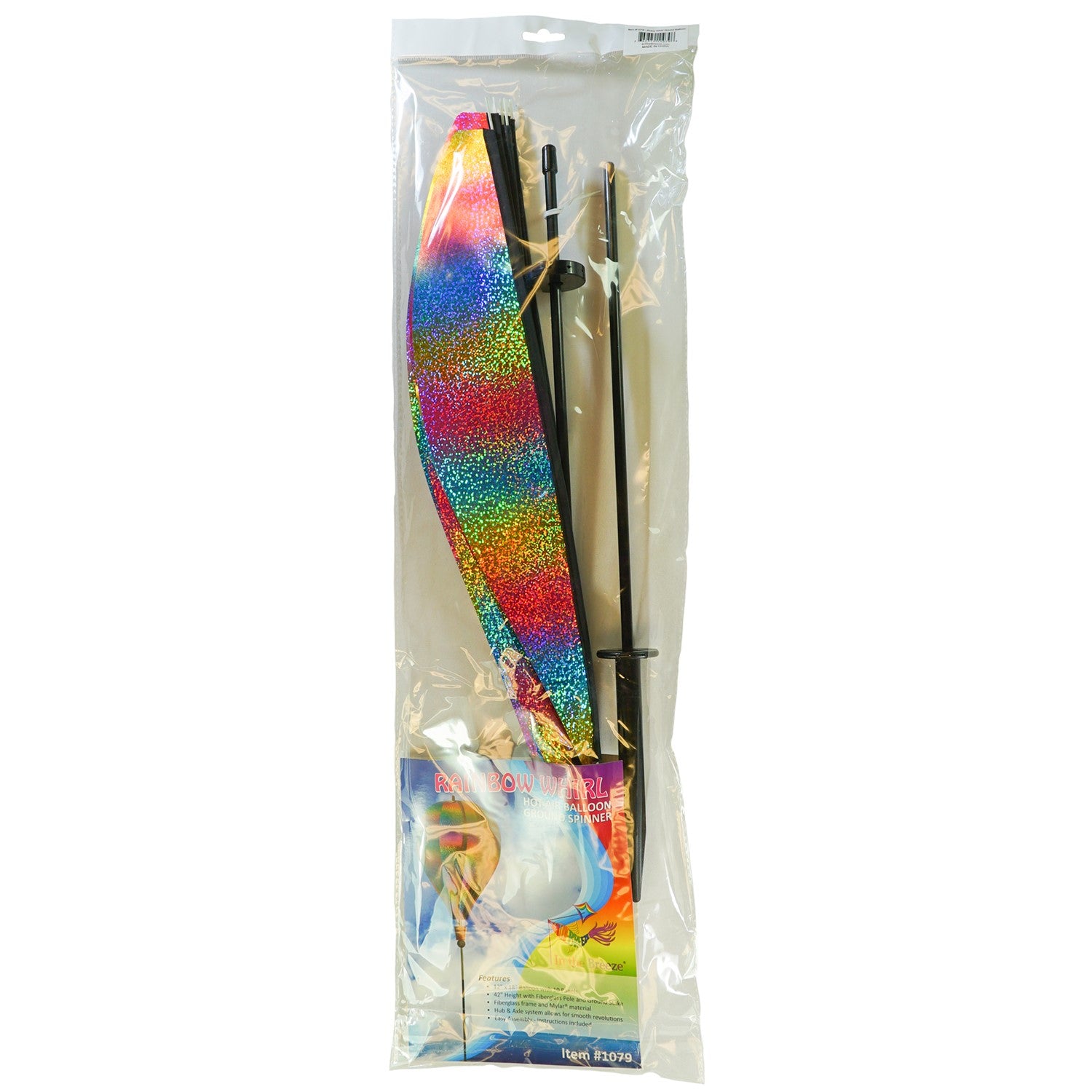 Rainbow Whirl 10-Panel Hot Air Balloon Ground Spinner with vibrant Mylar panels spinning gracefully in an outdoor garden setting.