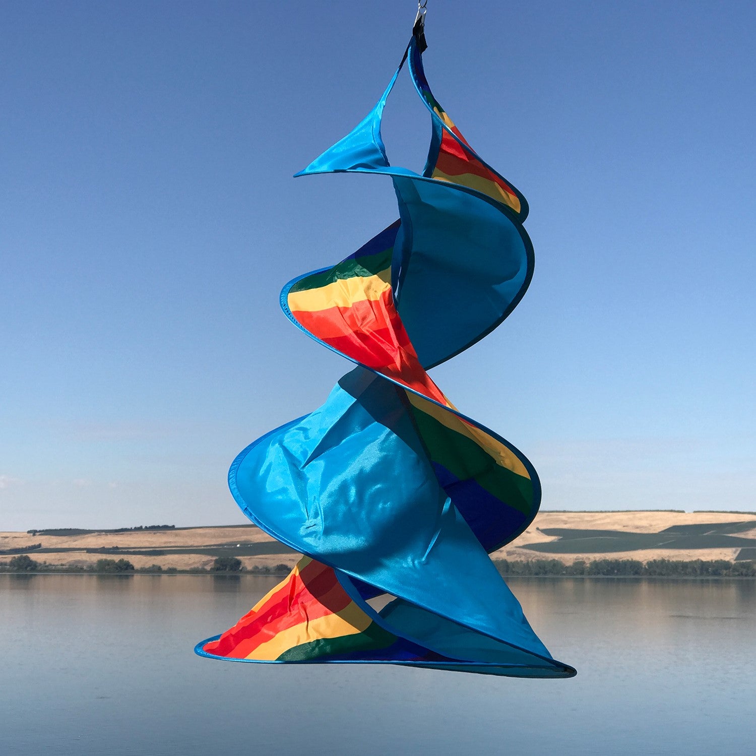 Rainbow Wow Spin Duet double spinner garden decor with vibrant colors in a gentle breeze, featuring intricate designs and durable materials.