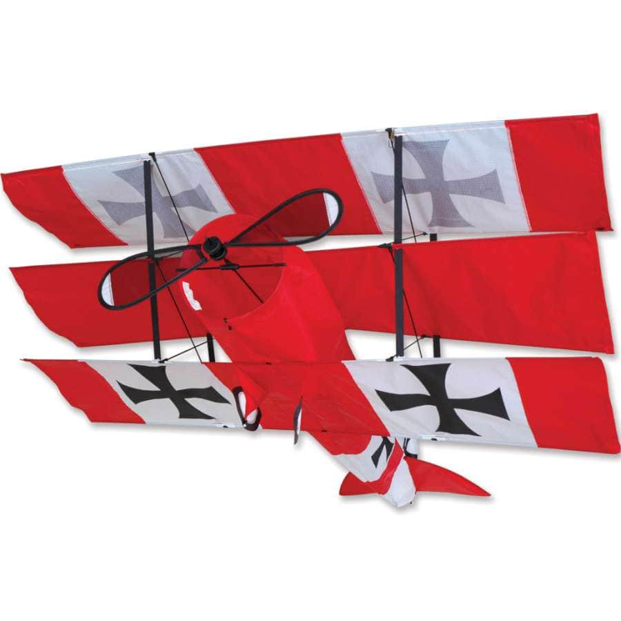 Red Baron tri-plane kite with WWI-style graphics, spinning propellers, durable construction, and smooth flight. Line and handle included.