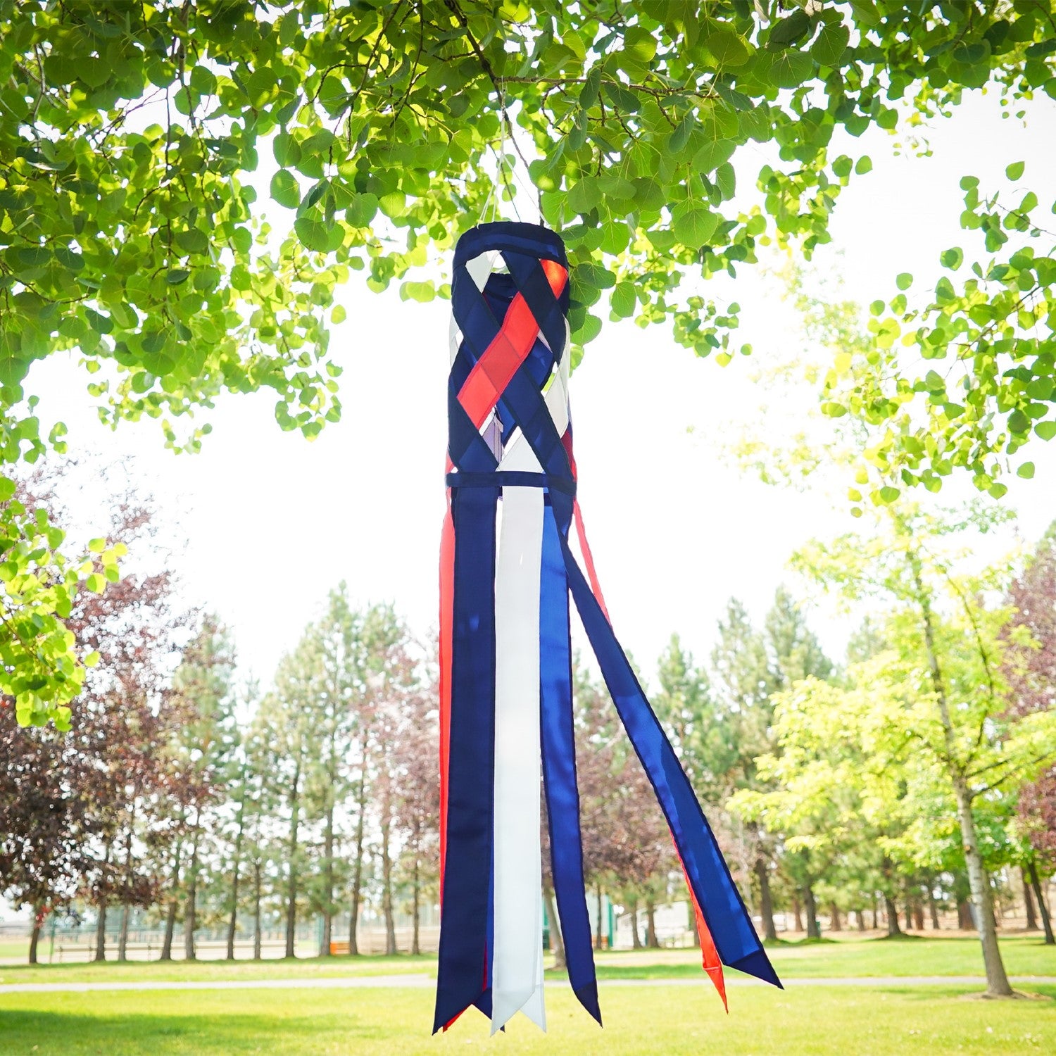 40-inch Red, White & Blue Diagonal Weave Windsock hanging outdoors, showcasing vibrant colors fluttering in the breeze.