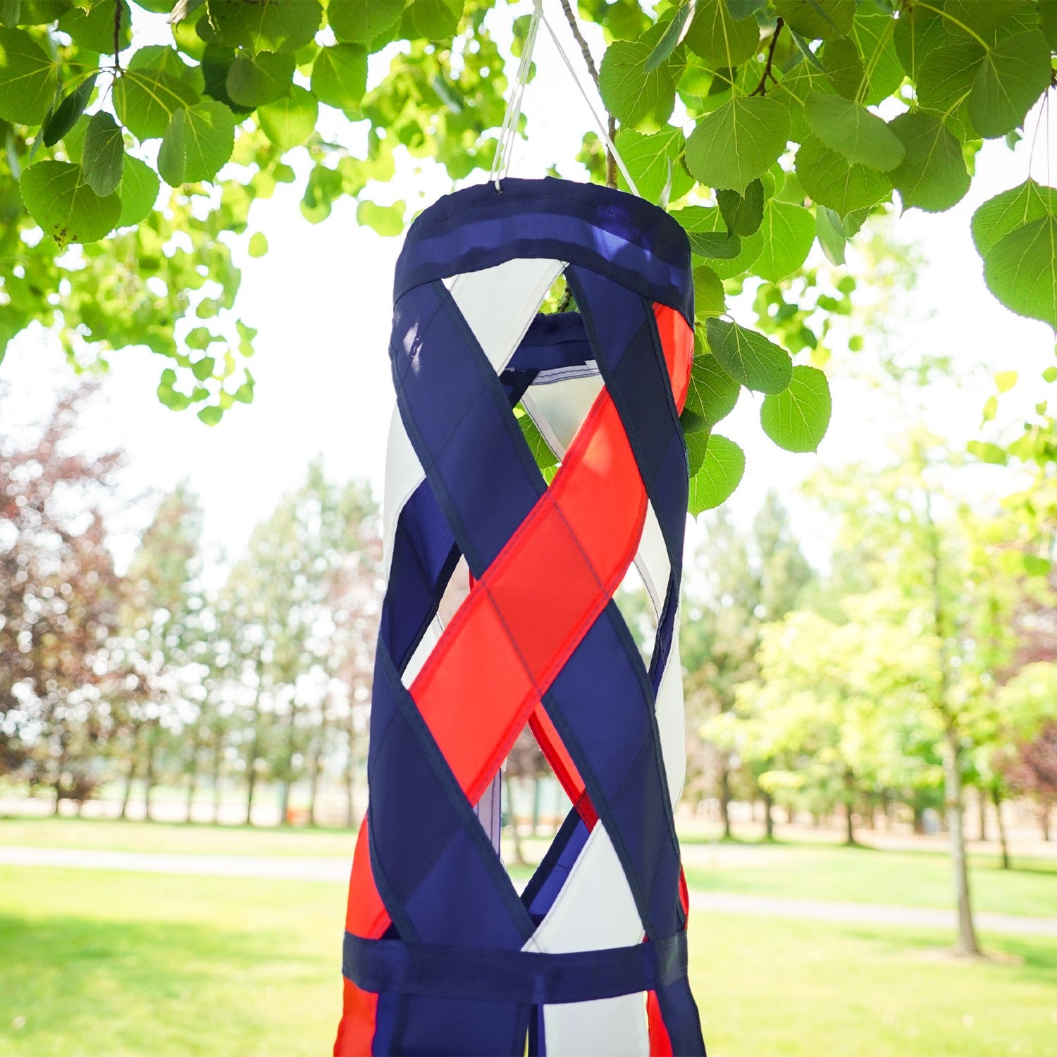 40-inch Red, White & Blue Diagonal Weave Windsock hanging outdoors, showcasing vibrant colors fluttering in the breeze.