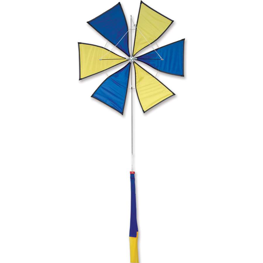 Roto Kite - Blue designed with a spinning propeller, 30x60 inch ripstop polyester kite soaring in a clear blue sky against a backdrop of vibrant green trees.