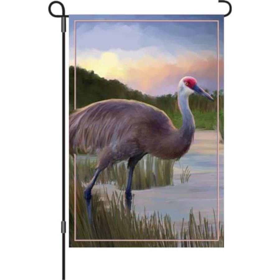 Sandhill Crane illuminated garden flag, 12 inches, featuring elegant bird designs in vibrant colors, displayed in a garden setting.