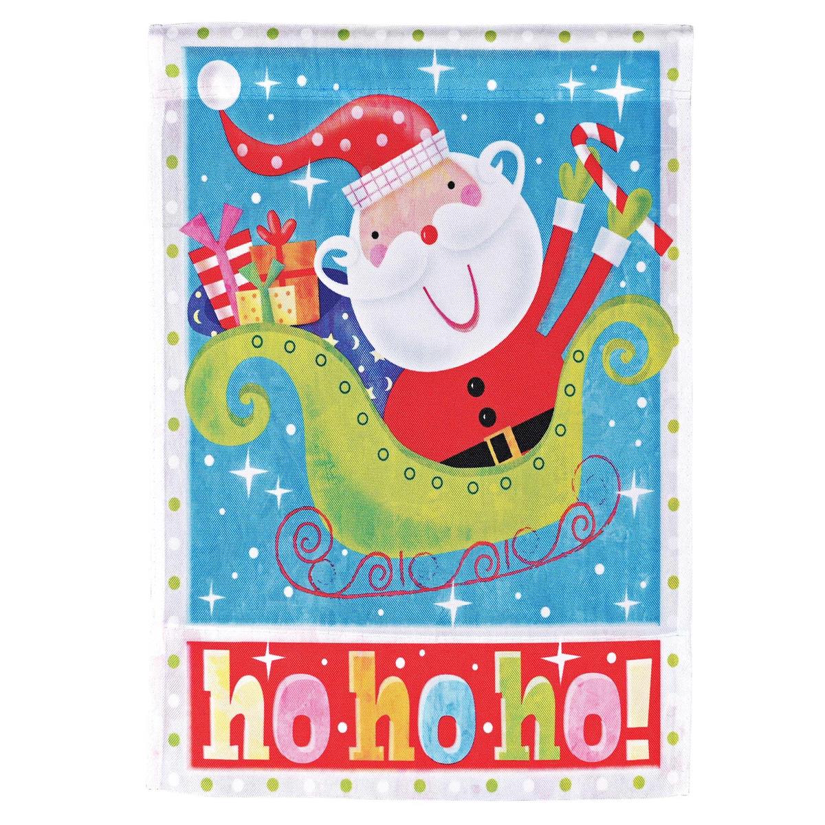 Santa Ho Ho Ho garden flag displayed outdoors, showcasing vibrant colors and cheerful design for the holiday season.