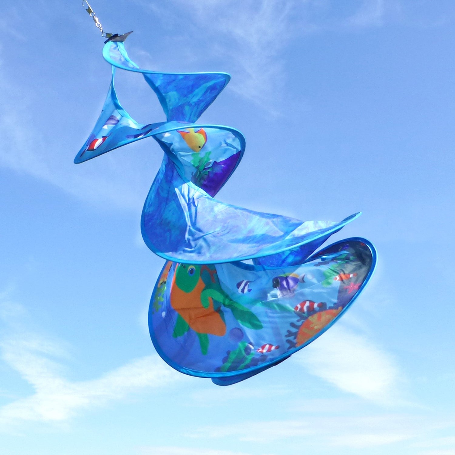 Sea Swimmers Spin Duet hanging garden decor featuring vibrant sea turtles spinning against a backdrop of ocean waves in an outdoor setting.