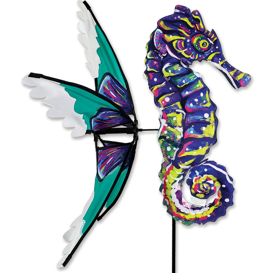Vibrant Seahorse Spinner outdoor decoration featuring detailed design, spinning gently in the wind among garden plants.