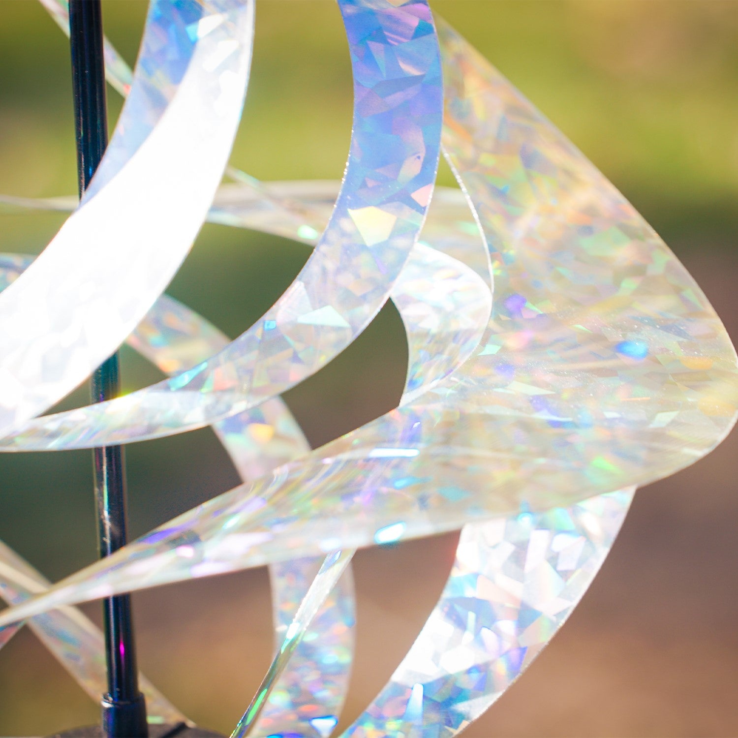 Silver Sparkle Vortex Spinner hanging freely from garden hook, showcasing sparkling Mylar spirals dancing in the sunlight.