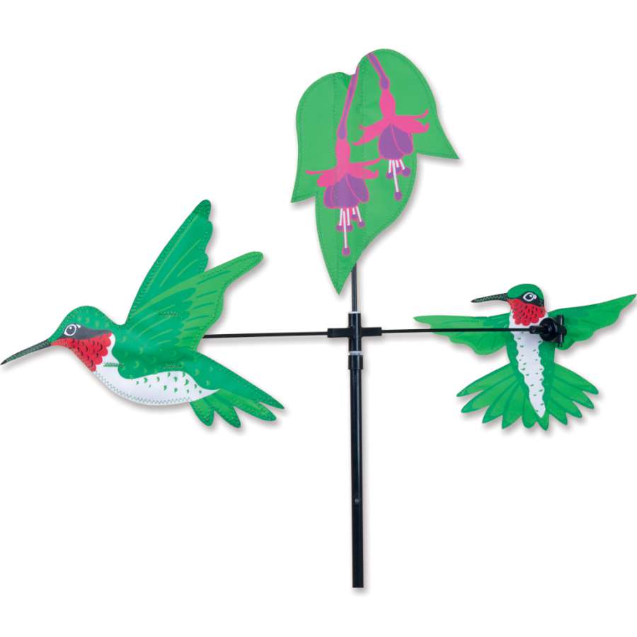 Single Carousel Spinner featuring vibrant hummingbird design whirling in the breeze, adding charm to a garden setting.