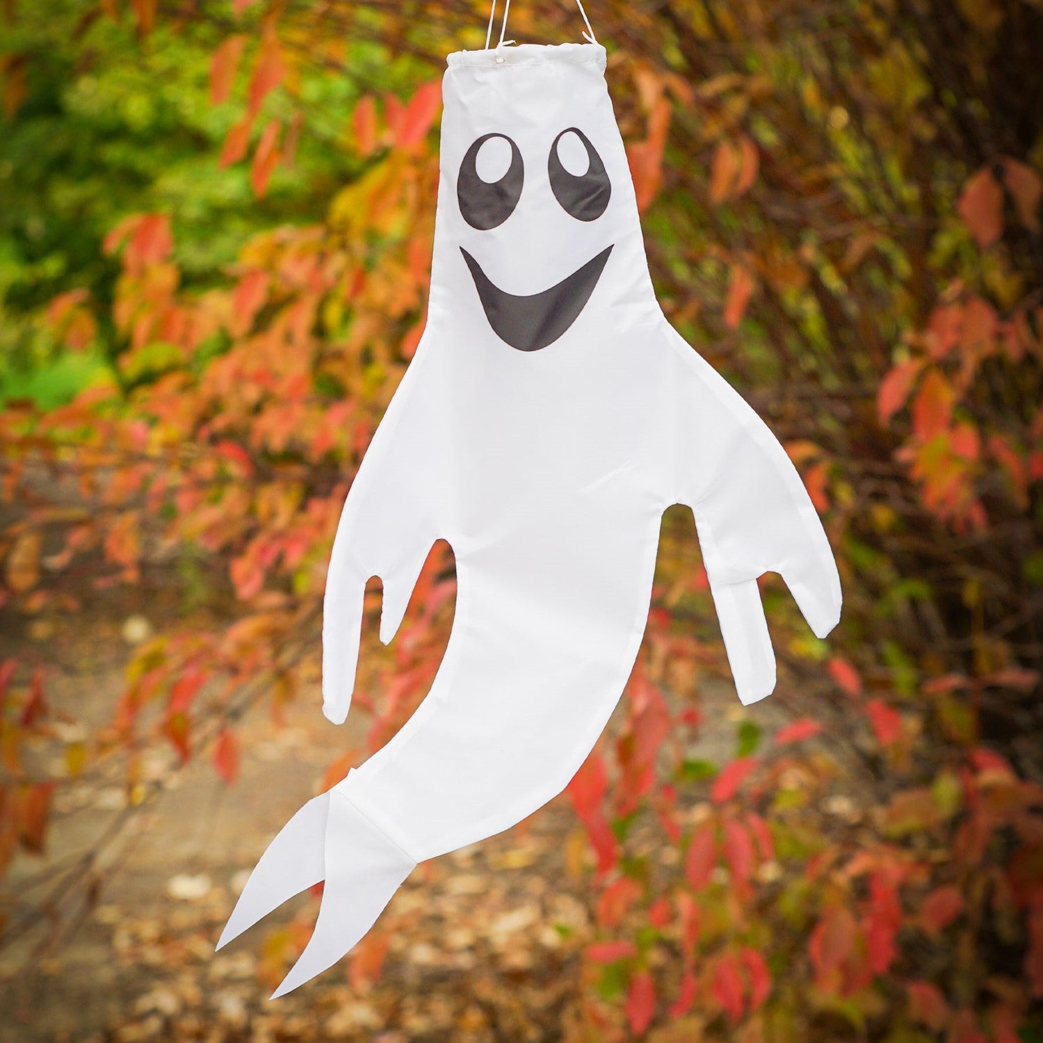 Small Ghost Windsock featuring a grinning ghost design swaying gently in the wind, perfect for autumn and Halloween decor.