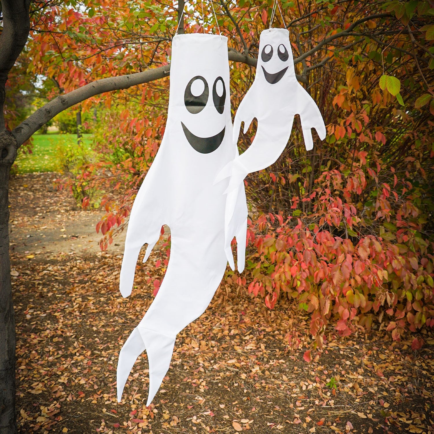 Small Ghost Windsock featuring a grinning ghost design swaying gently in the wind, perfect for autumn and Halloween decor.