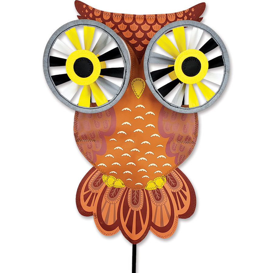 Small Night Owl Reflective Eyes Spinner with rotating reflective eyes displayed in a vibrant garden, catching the sunlight beautifully.