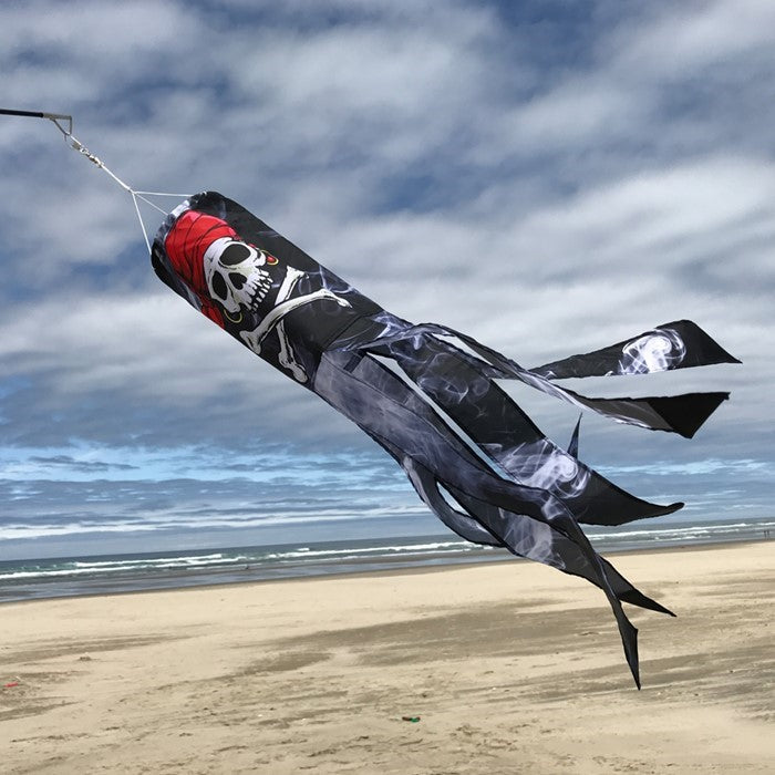 Smokin' Pirate 30' windsock with a detailed printed skull and bones design, suspended in the air against a blue sky backdrop.