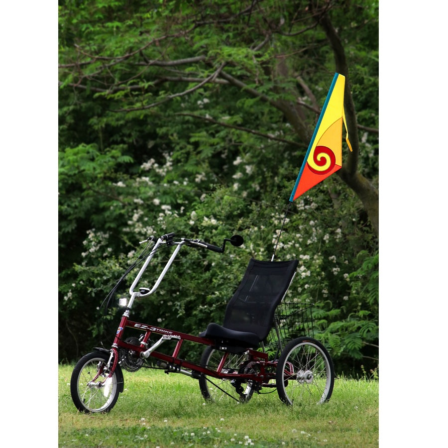 SoundWinds Spiral Recumbent Bike Flag displayed in a bright yellow color attached to a bicycle, featuring a durable pole designed for outdoor cycling.