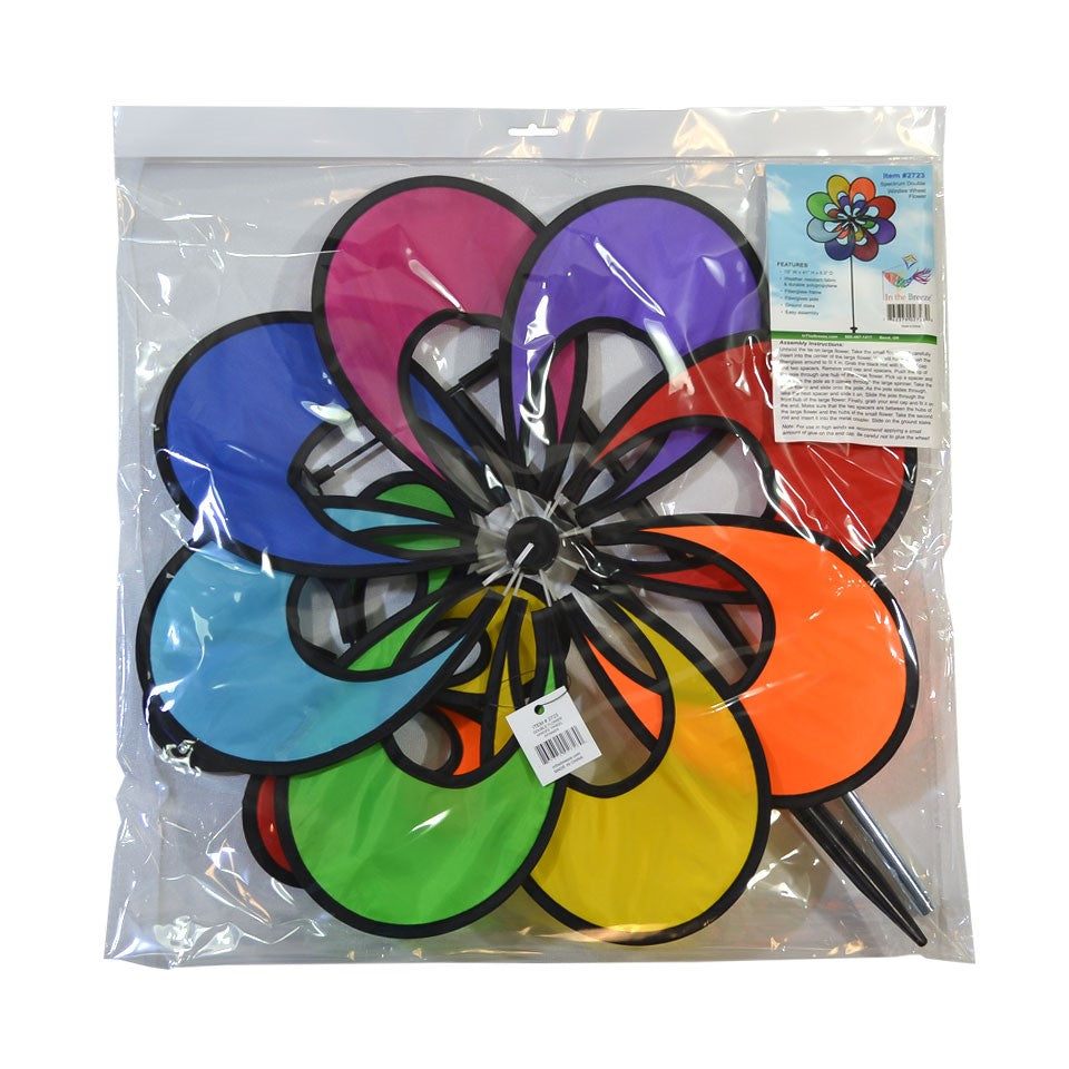 Spectrum Double Windee Wheelz rainbow petal spinner displayed in a garden, showing vibrant petals spinning joyfully in the breeze.