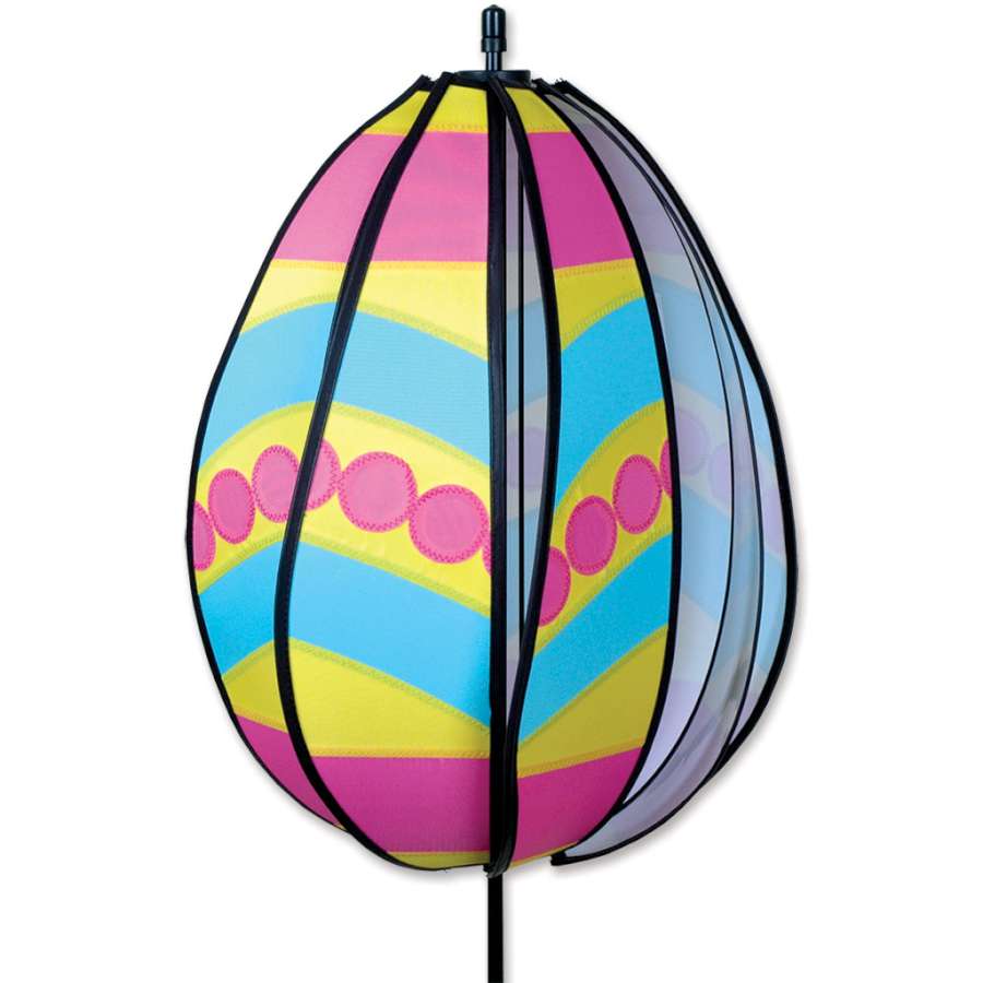 Spinning Egg Spinner - Pink Polka Dot rotating in a garden, adding a festive touch to outdoor Easter celebrations with bright colors.