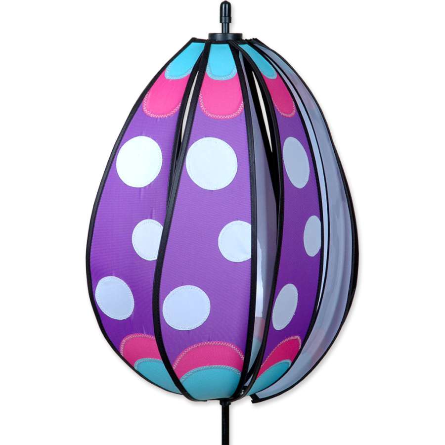 Spinning Egg Spinner in Purple Polka design, twirling gracefully in a garden setting, adding festive charm for Easter decorations.
