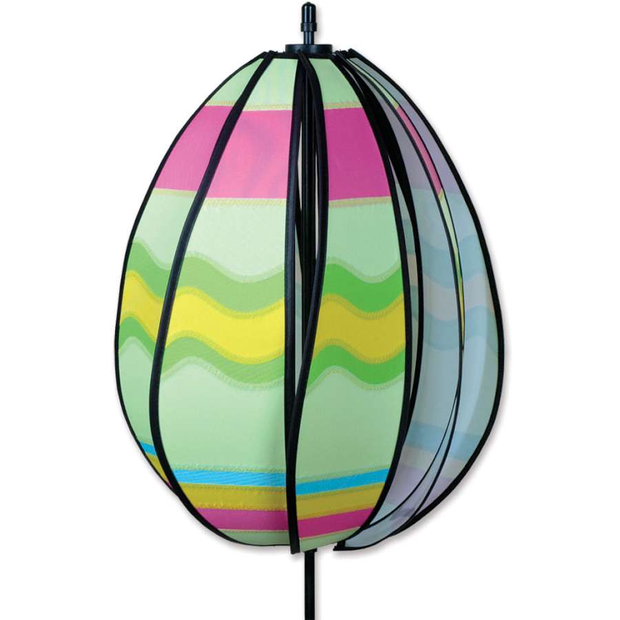 Wavy Green Spinning Egg Spinner rotating in a garden setting, showcasing vibrant colors and traditional patterns for Easter decorations.