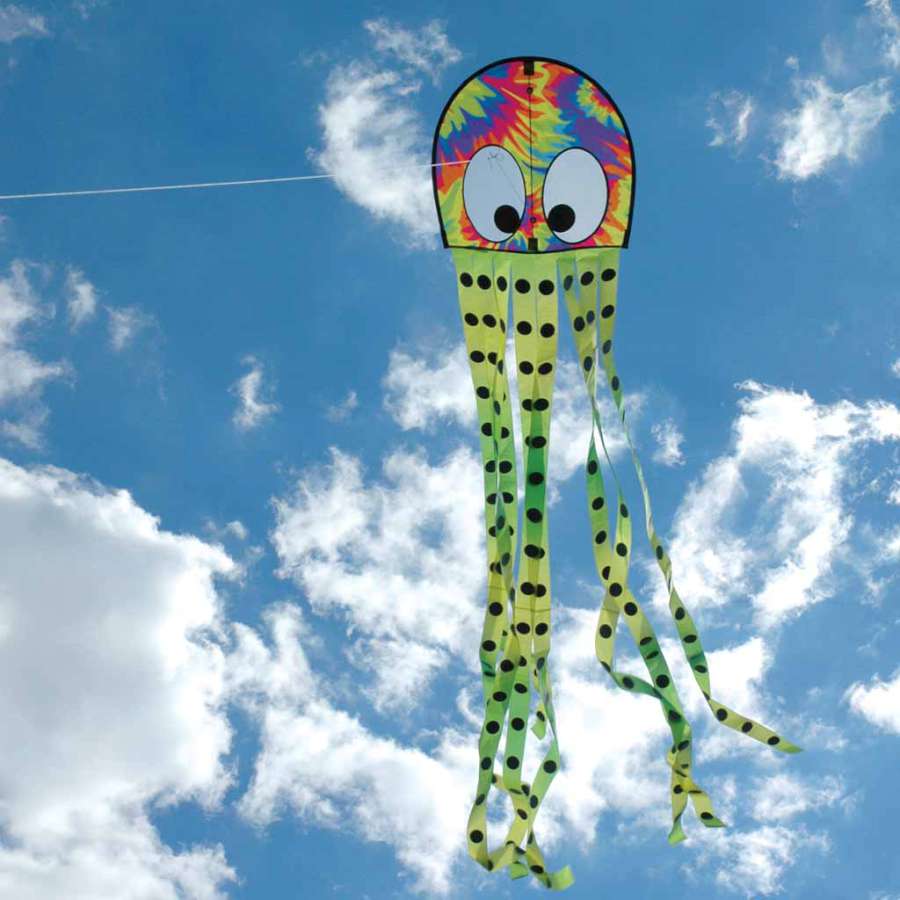 Colorful tie-dye Squeaky Kite shaped like an octopus soaring through the sky, measuring 20 x 80 inches, providing fun for families outdoors.