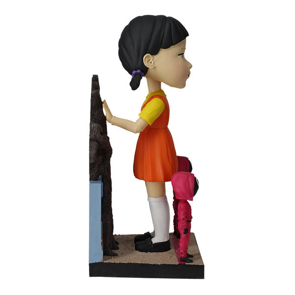 8-inch Squid Games Young-Hee Doll bobblehead displaying intricate details and vibrant colors, nodding on a sturdy base.