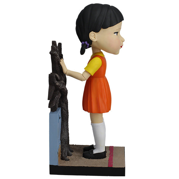 Squid Games Young-Hee Doll 10" bobblehead with detailed features and nodding action, perfect for horror collectors and fans of the series.