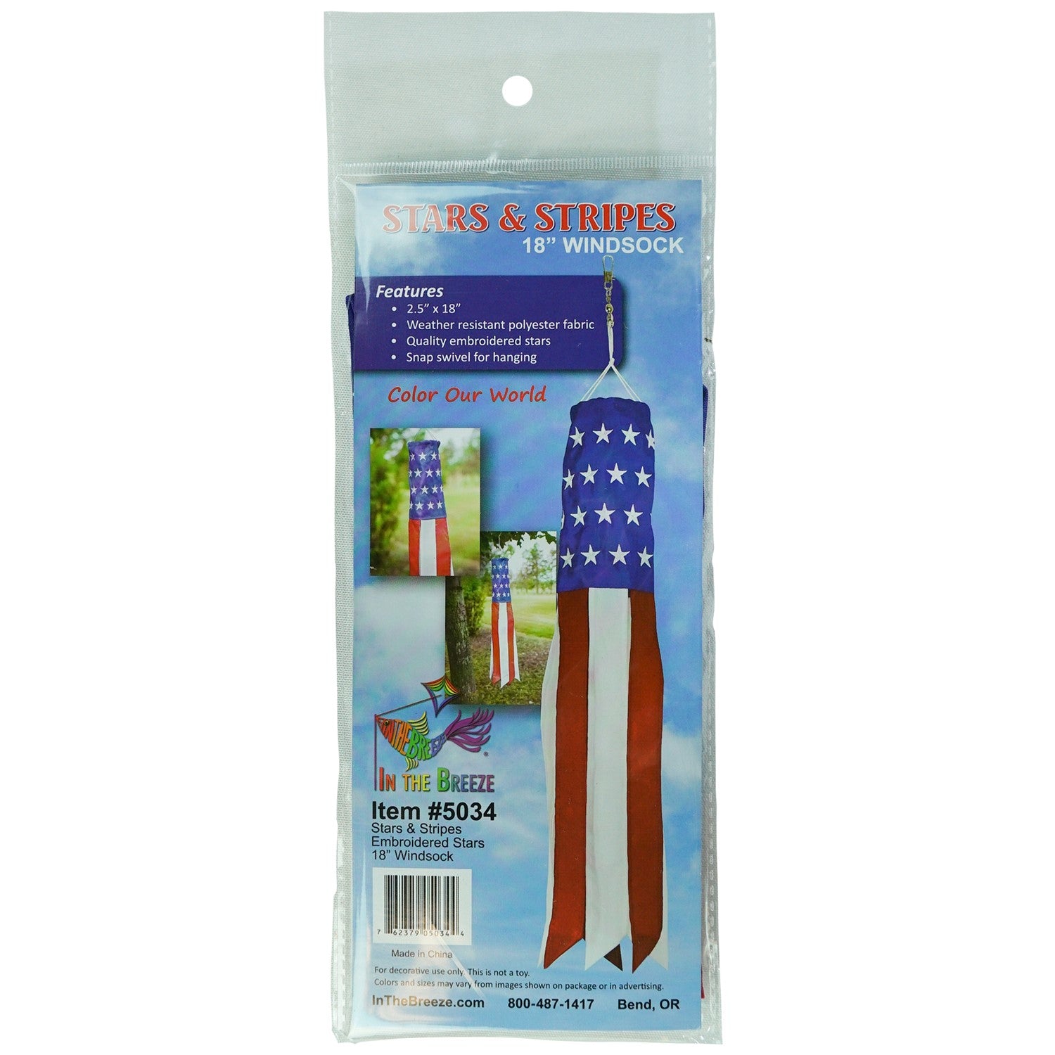 Brightly colored Stars & Stripes 18-inch windsock featuring USA flag design hanging outdoors, with vibrant tails fluttering in the breeze.