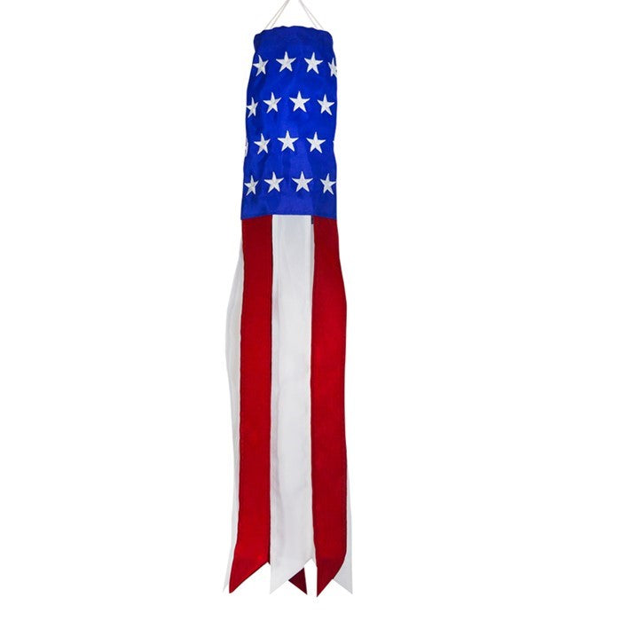 Brightly colored Stars & Stripes 18-inch windsock featuring USA flag design hanging outdoors, with vibrant tails fluttering in the breeze.