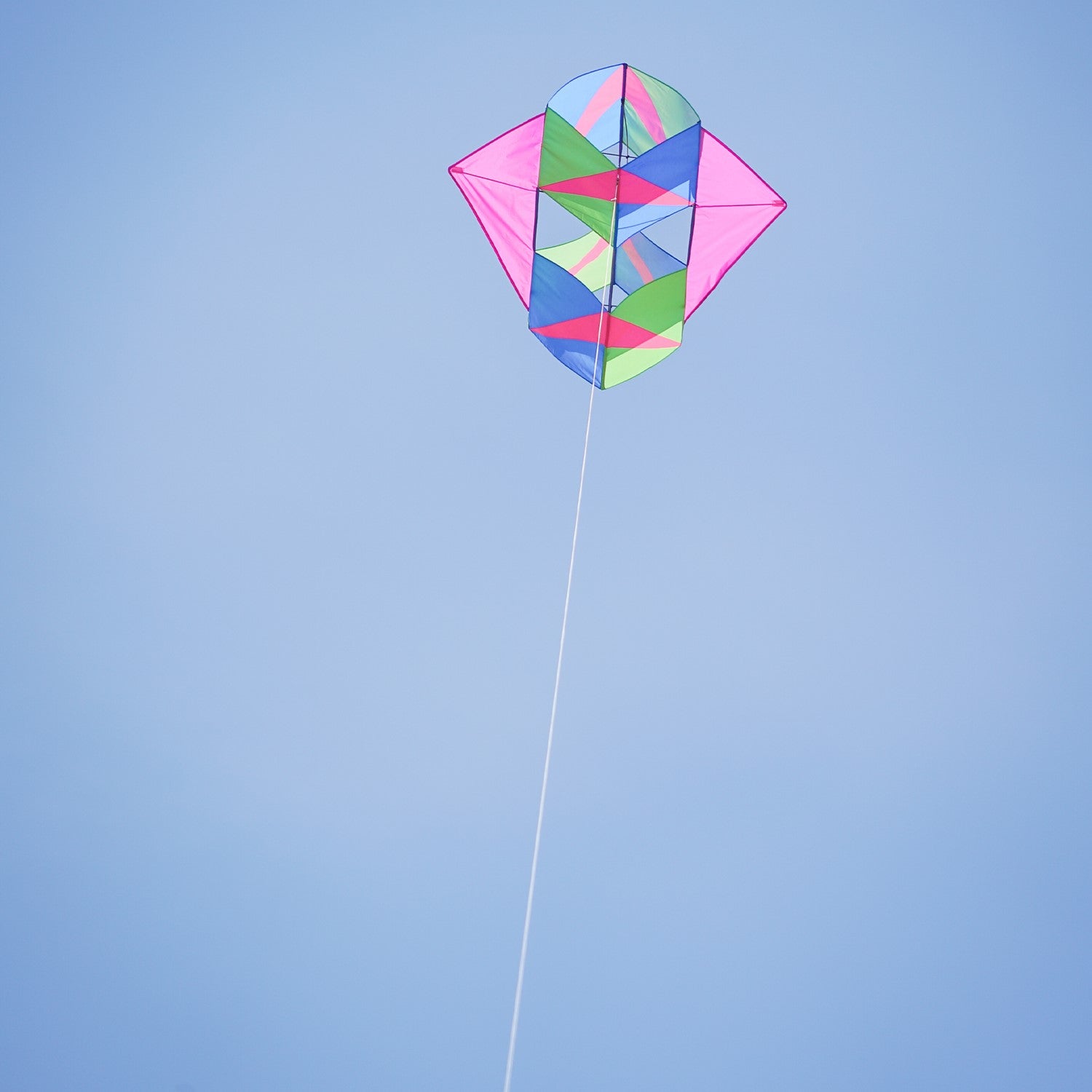 "Strike Winged Double Box Kite with vibrant design and wings displayed flying in a clear blue sky, showcasing its stability and durability.