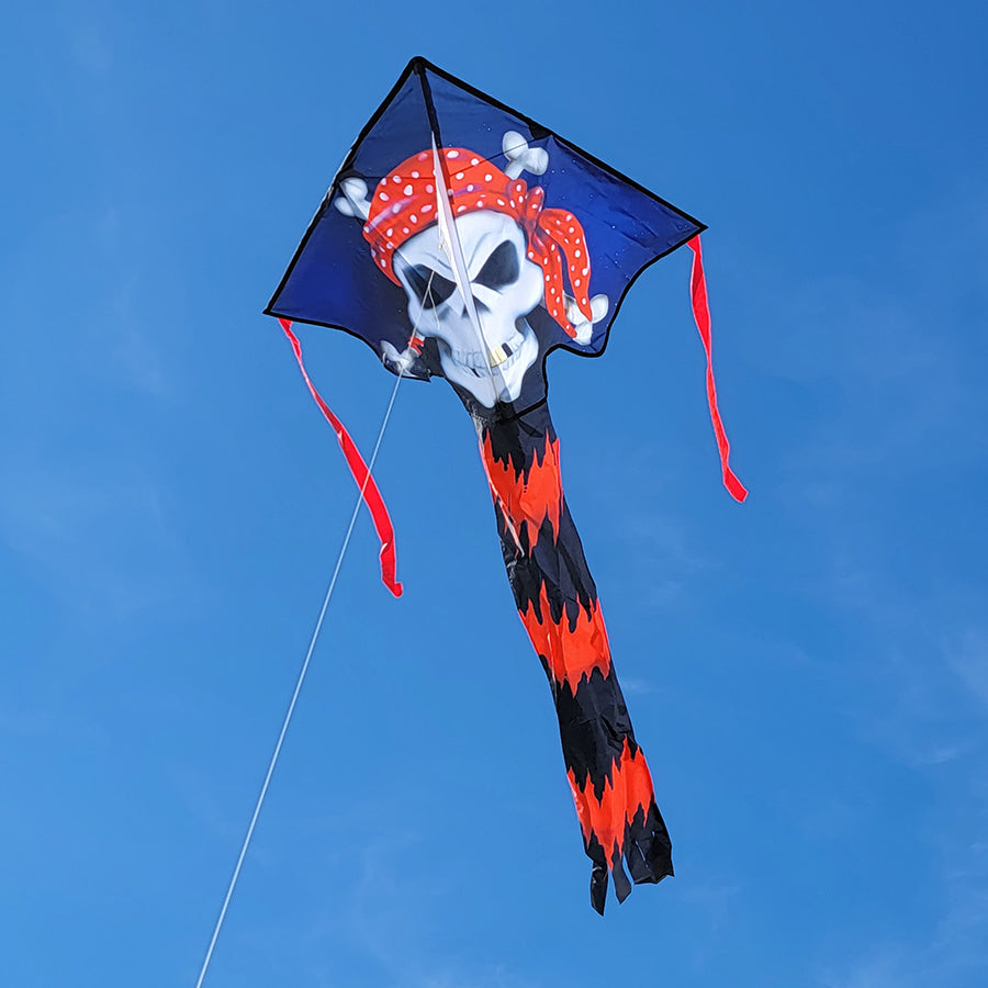 The Super Flier Kite - Pirate soaring through the sky, showcasing its vibrant pirate design and long banner tail, perfect for outdoor fun.