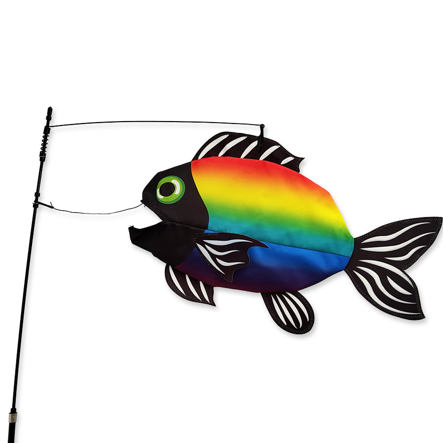 Bright Rainbow Swimming Fish outdoor decoration swaying in the breeze, showcasing its vibrant colors and playful design in a garden setting.