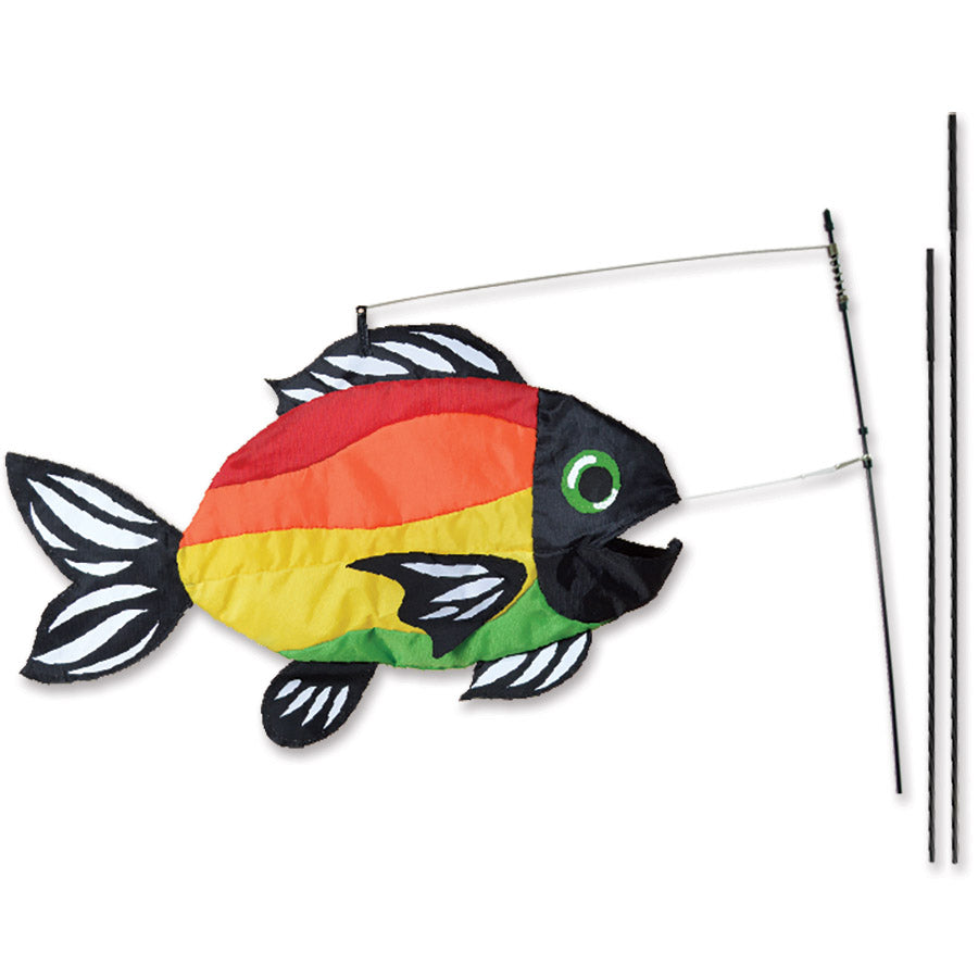 Swimming Fish Recumbent Bike Flag measuring 20x13 inches, designed to mimic a swimming fish, displayed on a recumbent bike outdoors.