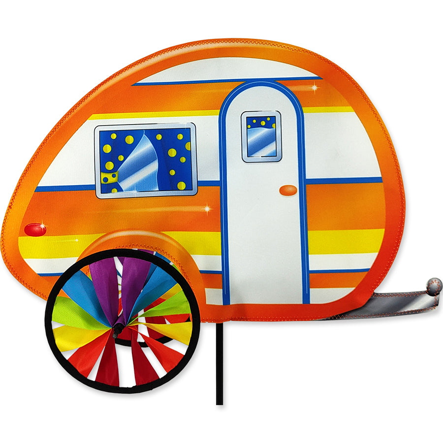 19-inch Teardrop Camper Spinner with vibrant colors spinning gracefully in a garden setting, capturing the essence of outdoor camping.