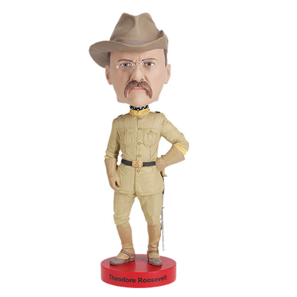 Teddy Roosevelt Bobblehead standing 8 inches tall, featuring detailed hand-painted likeness of Theodore Roosevelt with spectacles and a tailored suit.