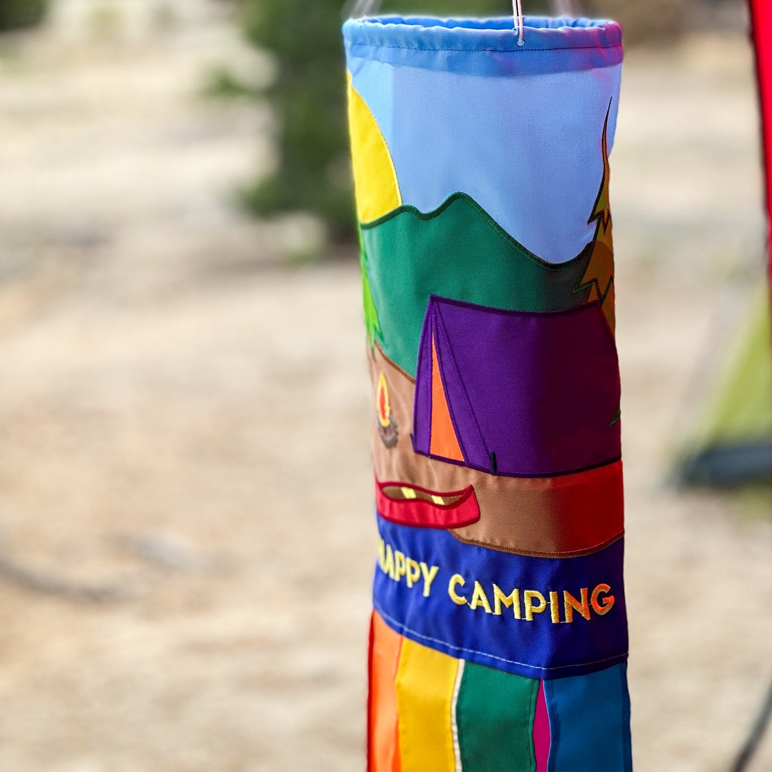 Tent Camping 40-inch windsock with colorful applique graphics and eight tails fluttering in a gentle breeze, designed for outdoor decoration.