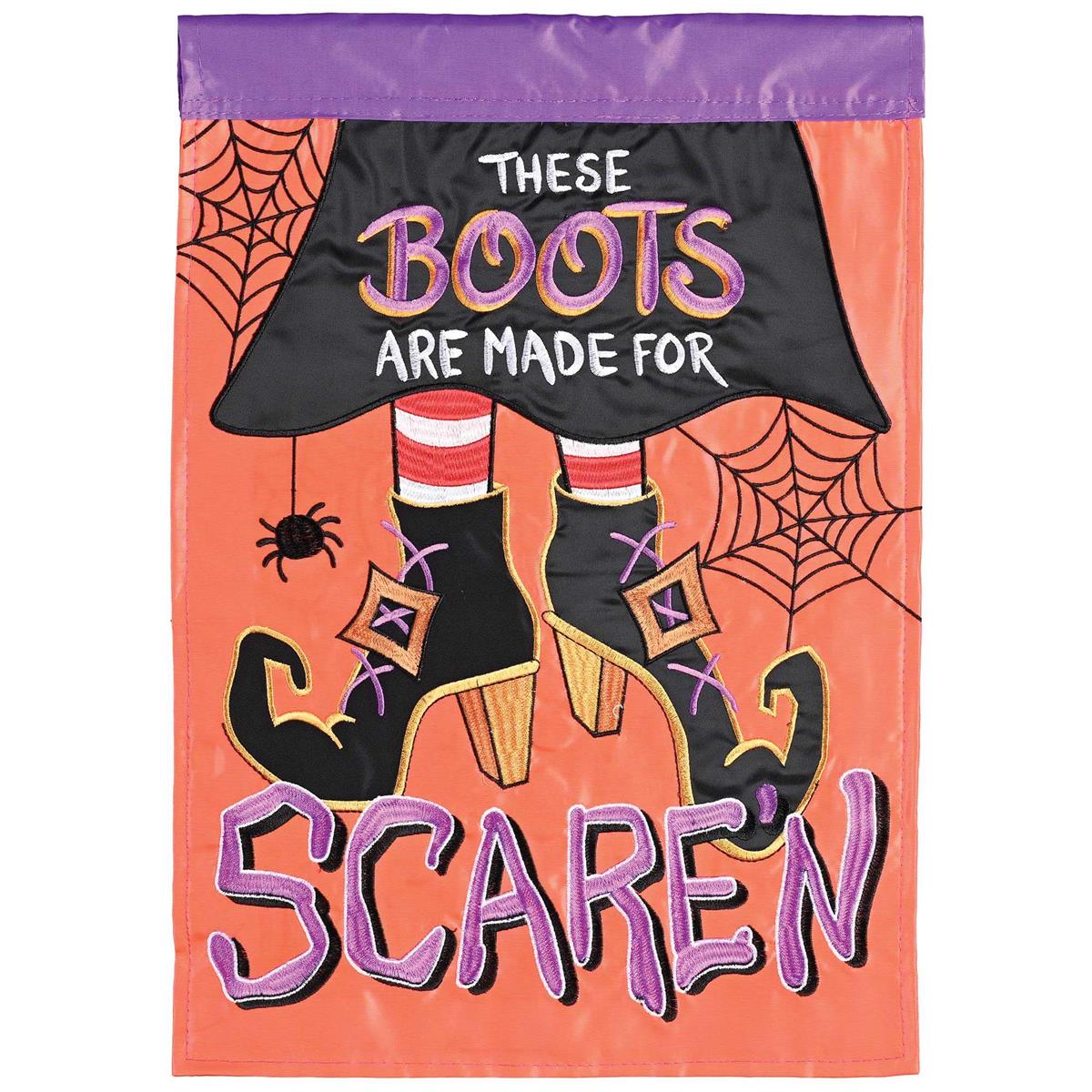 These Boots Made For Scare-n banner flag, measuring 29x42 inches, featuring colorful Halloween designs, displayed outside in a festive setting.