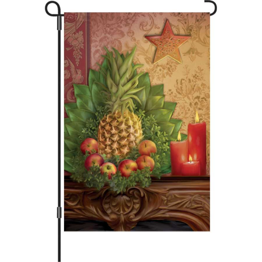 12 in. Traditional Pineapple garden flag featuring a colorful pineapple design displayed on a flag stand in an outdoor setting.