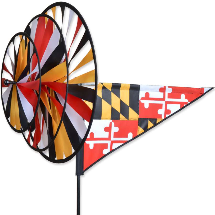 Triple Spinner - Maryland with colorful flag design spinning in an outdoor garden setting, showcasing dynamic motion and vivid colors.