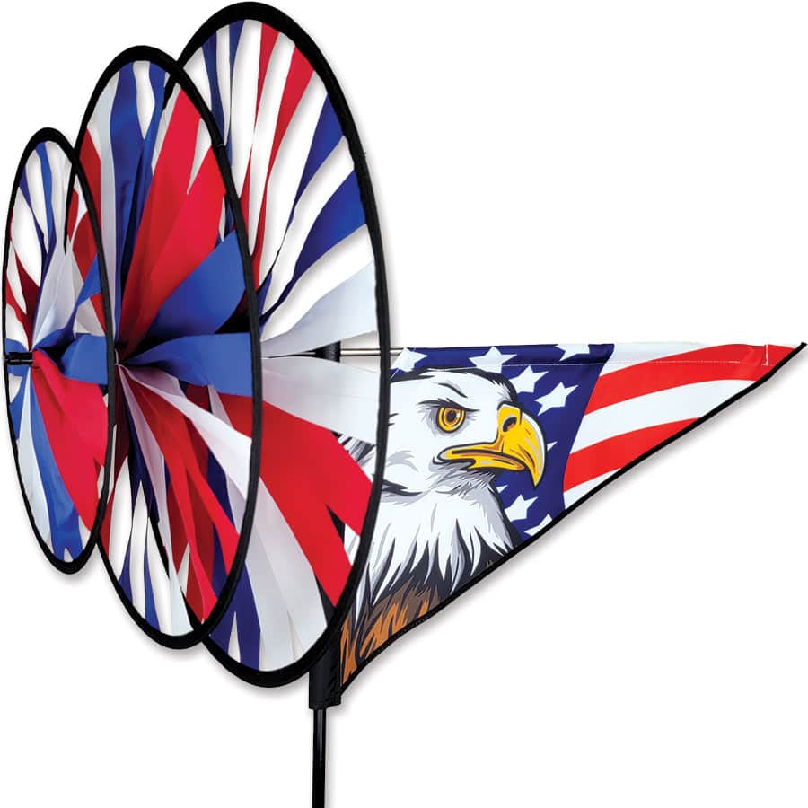 Outdoor spinner with spinning American flag wheels and bald eagle detail, built from weather-resistant SunTex fabric and heavy-duty fiberglass poles.