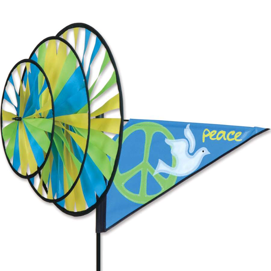 Triple Spinner - Peace with rotating elements in a garden, showcasing vibrant colors and durable SunTex(TM) fabric in a gently breezy setting.