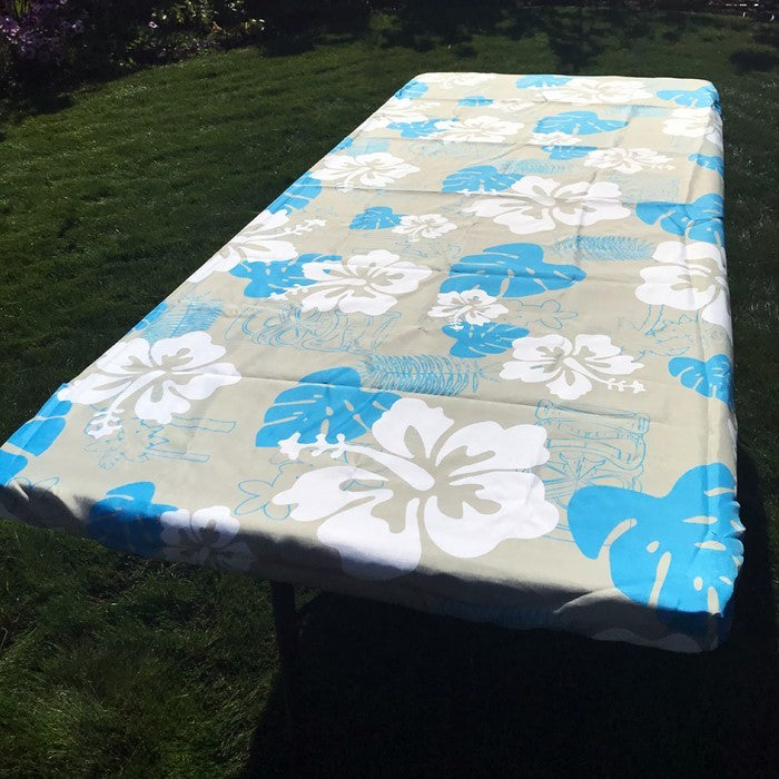 Vibrant Tropical 6' Tablecloth secured on a picnic table, showcasing its colorful pattern and deep pockets for outdoor use.