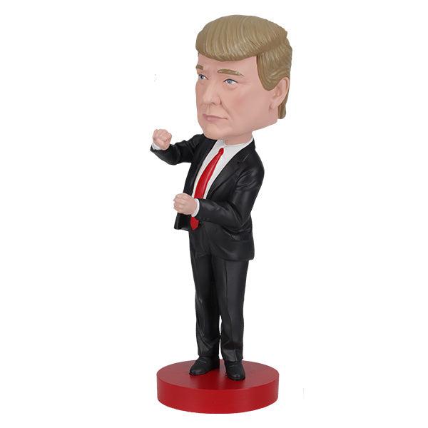 Trump Dance Bobblehead displaying Donald Trump in a suit with a playful dance pose, highlighting vibrant details for political humor lovers.